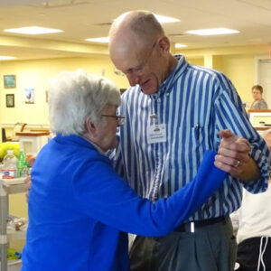 Vermont Alzheimer's care center resident dances with staff