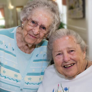 Beautiful residents of Windsor retirement community smile together