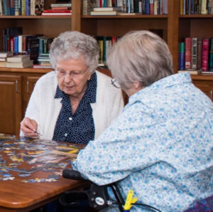 Windsor senior living residents enjoy doing a puzzle