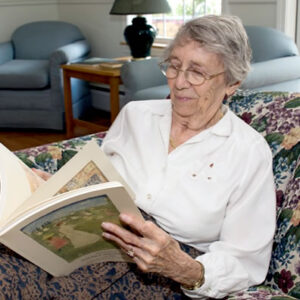 Windsor senior living community resident reads a book