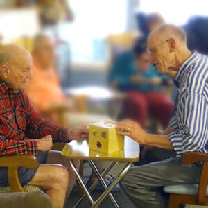 Man works on puzzle at Vermont Alzheimer's care facility